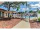 Community pool with picnic tables and gated access at 9481 Highland Oak Dr # 807, Tampa, FL 33647