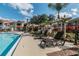 Relaxing poolside lounge area with pergola at 9481 Highland Oak Dr # 807, Tampa, FL 33647