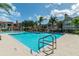 Inviting community pool with lounge chairs at 9481 Highland Oak Dr # 807, Tampa, FL 33647