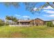 Large backyard with a pool and string lights at 1307 Windjammer Pl, Valrico, FL 33594