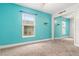 Light teal bedroom with mirrored closet and window at 1307 Windjammer Pl, Valrico, FL 33594