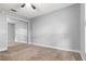 Bright bedroom with mirrored closet doors and neutral carpeting at 1307 Windjammer Pl, Valrico, FL 33594