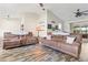 Spacious living area with two reclining sofas and an open floor plan at 1307 Windjammer Pl, Valrico, FL 33594