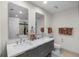 Modern bathroom with double vanity and large mirrors at 175 1St S St # 704, St Petersburg, FL 33701