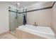 Clean bathroom with soaking tub and glass shower at 175 1St S St # 704, St Petersburg, FL 33701
