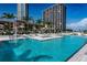 Resort-style pool with lounge chairs and umbrellas at 175 1St S St # 704, St Petersburg, FL 33701