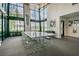 Modern community room with large windows and a long table at 2409 Hearth Dr, Odessa, FL 33556