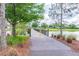 Wooden footbridge over a tranquil lake in a community at 2409 Hearth Dr, Odessa, FL 33556