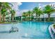 Large community pool with water feature and lounge area at 2409 Hearth Dr, Odessa, FL 33556