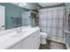 Bathroom with shower/tub combo, white vanity, and neutral decor at 2413 Crestview Rd, Wimauma, FL 33598