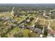 Aerial view of a house and surrounding neighborhood, showing property lines and nearby homes at 2609 65Th E St, Bradenton, FL 34208