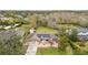 Aerial view of a single Gathering home with solar panels and a large backyard at 2609 65Th E St, Bradenton, FL 34208