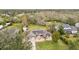Aerial view showing a single Gathering home with solar panels and a spacious backyard at 2609 65Th E St, Bradenton, FL 34208