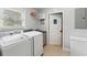Practical laundry room with washer, dryer, and utility sink at 2609 65Th E St, Bradenton, FL 34208