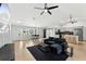 Open concept living room, kitchen, and dining area with hardwood floors at 2609 65Th E St, Bradenton, FL 34208