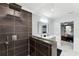 Large walk-in shower with dark tile and glass enclosure at 2609 65Th E St, Bradenton, FL 34208