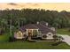Luxury home with landscaped yard and driveway, nestled in a wooded area at 2914 Shipston Ave, New Port Richey, FL 34655