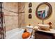 Stylish bathroom with a vessel sink, tile shower, and decorative accents at 2914 Shipston Ave, New Port Richey, FL 34655