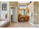 Bathroom with a vanity, walk-in shower, and access to a private toilet at 2914 Shipston Ave, New Port Richey, FL 34655