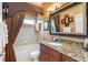 Elegant bathroom with granite countertop, tiled shower, and decorative accents at 2914 Shipston Ave, New Port Richey, FL 34655
