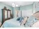 Relaxing bedroom featuring a light blue color scheme and ample closet space at 2914 Shipston Ave, New Port Richey, FL 34655