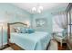 Serene bedroom with light blue bedding and stylish accents at 2914 Shipston Ave, New Port Richey, FL 34655