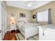 Bright bedroom with white furniture and coastal-themed decor at 2914 Shipston Ave, New Port Richey, FL 34655