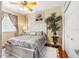 Guest bedroom with a queen-size bed and mirrored closet doors at 2914 Shipston Ave, New Port Richey, FL 34655