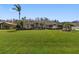 Beautiful house with a lush green lawn and palm trees at 2914 Shipston Ave, New Port Richey, FL 34655