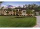Elegant two-story home with a manicured lawn and a paved driveway at 2914 Shipston Ave, New Port Richey, FL 34655
