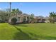 Spacious home with a well-maintained lawn and palm trees at 2914 Shipston Ave, New Port Richey, FL 34655