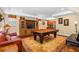 Basement game room with pool table, wet bar, and seating at 2914 Shipston Ave, New Port Richey, FL 34655