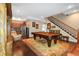 Game room featuring a pool table and adjacent staircase at 2914 Shipston Ave, New Port Richey, FL 34655