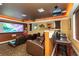 Home theater with projector, bar seating, and large screen at 2914 Shipston Ave, New Port Richey, FL 34655