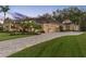 Luxury home exterior at dusk, showcasing a large yard and driveway at 2914 Shipston Ave, New Port Richey, FL 34655