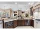 Modern kitchen featuring a large island and granite countertops at 2914 Shipston Ave, New Port Richey, FL 34655