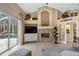 Comfortable living room featuring a stone fireplace and large windows at 2914 Shipston Ave, New Port Richey, FL 34655