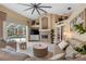 Spacious living area with a cozy fireplace and seating for multiple guests at 2914 Shipston Ave, New Port Richey, FL 34655