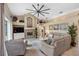 Relaxing living room with a fireplace and access to the pool area at 2914 Shipston Ave, New Port Richey, FL 34655