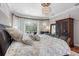 Main bedroom with king-size bed, hardwood floors and large windows at 2914 Shipston Ave, New Port Richey, FL 34655