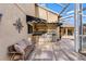 Outdoor kitchen with stainless steel appliances and seating area at 2914 Shipston Ave, New Port Richey, FL 34655