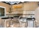 Stainless steel appliances and granite countertops in this outdoor kitchen at 2914 Shipston Ave, New Port Richey, FL 34655