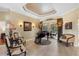 Elegant piano room with French doors opening to a view of the pool at 2914 Shipston Ave, New Port Richey, FL 34655