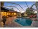 Spacious pool area with seating and a covered patio at 2914 Shipston Ave, New Port Richey, FL 34655