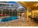 Inviting pool and patio area with covered lanai and lounge chairs at 2914 Shipston Ave, New Port Richey, FL 34655
