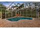 Inviting, kidney-shaped pool with a relaxing patio area at 2914 Shipston Ave, New Port Richey, FL 34655