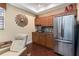 Basement wet bar with stainless steel appliances and wood cabinets at 2914 Shipston Ave, New Port Richey, FL 34655