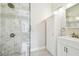Modern bathroom with marble shower and white vanity at 301 Old Hopewell Rd, Plant City, FL 33567