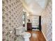 Vintage bathroom with clawfoot tub and floral wallpaper at 301 Old Hopewell Rd, Plant City, FL 33567