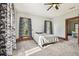 Spacious bedroom with two windows and a ceiling fan at 301 Old Hopewell Rd, Plant City, FL 33567